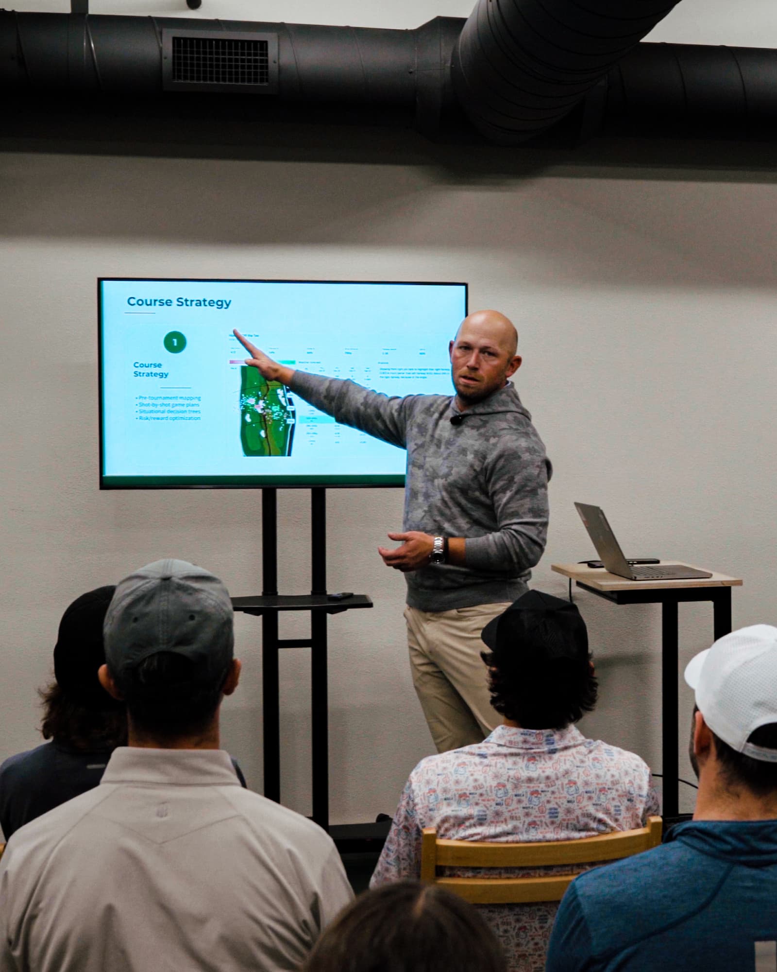 Cory Jez presenting to a college golf team